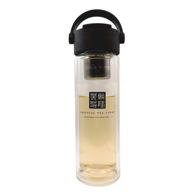 Clear glass tea infuser bottle with black lid on a white background