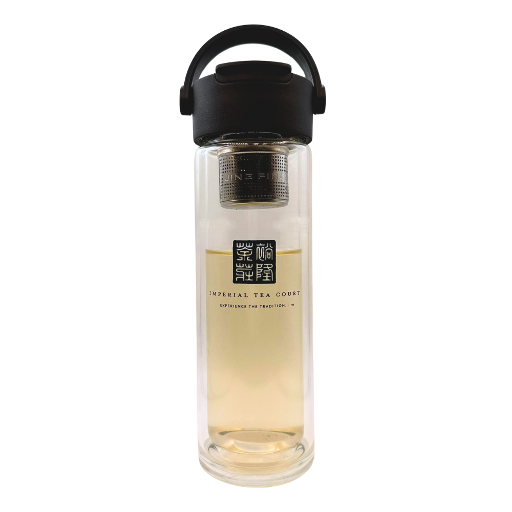 Clear glass tea infuser bottle with black lid on a white background